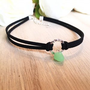 Bright mint green sea glass gem mounted on a circular ring connected to a double strand double choker necklace